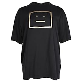 Schwarzes Baumwoll-T-Shirt mit goldfarbigem Grafik-Gesichtsdruck von Acne Studios