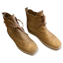Sneakers Chanel in pelle dorata