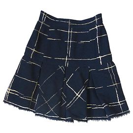 Falda Chanel negra y dorada de seda y lana