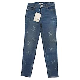 Jeans Chanel in denim blu slim stretch con logo CC