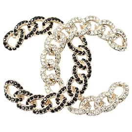 Spilla in strass nera e dorata di Chanel