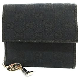 Portafoglio bi-fold Gucci in tela GG nera e pelle