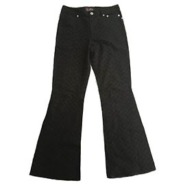 Pantalones bordados negros de corte bootcut vintage de los años 90 de John Galliano.