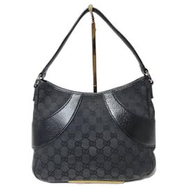 Borsa hobo curva in tela GG monogramma GUCCI con pelle