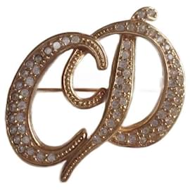 Spilla Christian Dior iniziali CD oro e cristallo