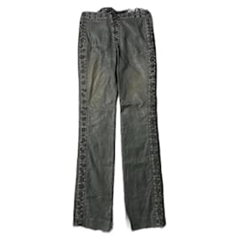 Jeans noirs à lacets Yves Saint Laurent par Tom Ford de la collection Printemps Été 2002.