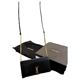 Sac à main Yves Saint Laurent en cuir noir et doré