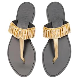 Infradito con logo in cristallo Moschino