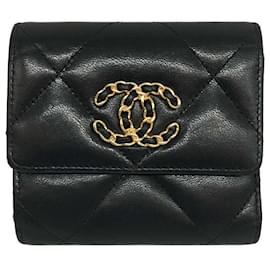 Mini portafoglio a flap in pelle di agnello nero Chanel