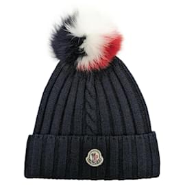 Berretto Moncler in lana blu navy con pompon di volpe