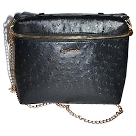 Bolsa de mão Guy Laroche preta em couro sintético com alça dourada