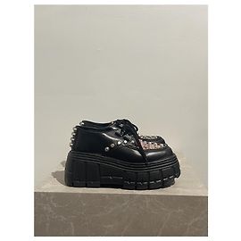 Mule e zoccoli MIU MIU T.EU 37.5 Pelle