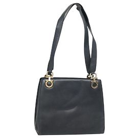 Bolso Tote Gancini de cuero negro y dorado Salvatore Ferragamo Auth 90254