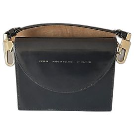 Autre Marque Borsa a mano Chylak in pelle nera con dettagli dorati