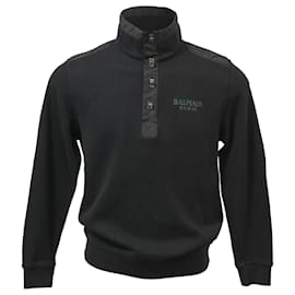 Schwarzer Wollpullover mit Balmain-Logo und verdrehten Knöpfen