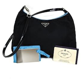 Borsa Prada Cleo in nylon nero e pelle verniciata blu