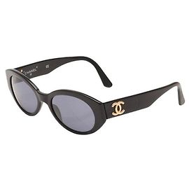Occhiali da sole Chanel neri e dorati in plastica