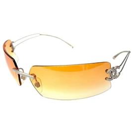 Gafas de sol Chanel sin montura con strass rosa y logotipo CC dorado