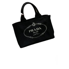 Bolso de mano Prada Canapa en lona negra con herrajes dorados