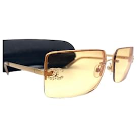 Occhiali da sole Chanel CC Logo con strass marrone giallo con tonalità dorata