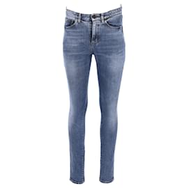 Jeans slim in denim blu con logo ricamato di Saint Laurent