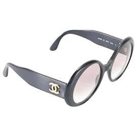 Gafas de sol Chanel Ovaladas Negras con logo CC dorado 0014