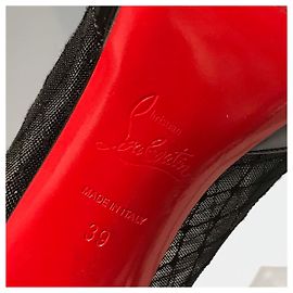 CHRISTIAN LOUBOUTIN Botas de tornozeleira T.EU 39 Couro envernizado