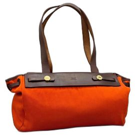 Hermès La sua borsa a spalla in pelle e tela arancione
