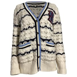 Strickjacke aus cremefarbener Wolle mit Ludvik-Logo-Patch von Sandro Paris