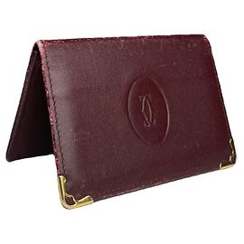 Porte-monnaie en cuir verni bordeaux Cartier