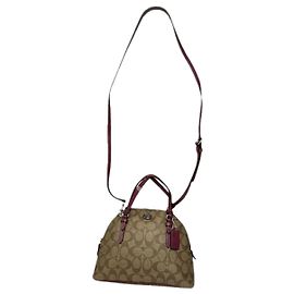 Bolso de mano de cuero marrón Sufflette Signature de Coach