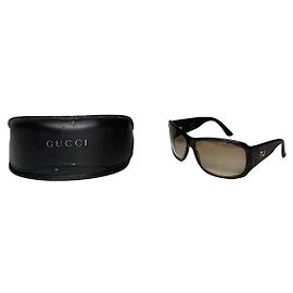 Occhiali da sole in plastica marroni Gucci