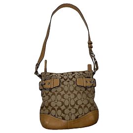 Bolso de mano de cuero marrón Sufflette Signature de Coach