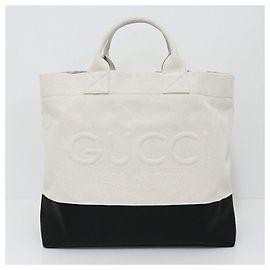 Bolso tote de lona con detalles en relieve GUCCI