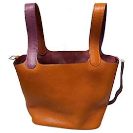Borsa a mano Hermès in pelle arancione e viola scuro