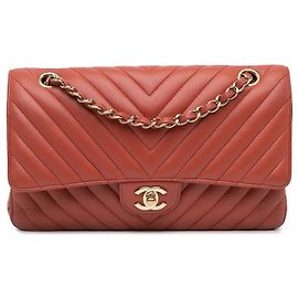 Chanel Naranja Medio Clásico Chevron Piel de Cordero Doble