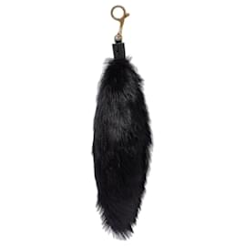 Charm per borsa Burberry in shearling nero e oro