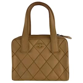 Borsa a mano Chanel con cucitura selvaggia beige