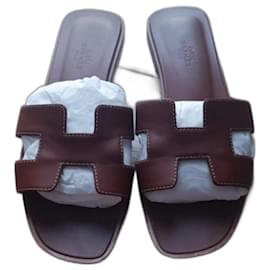 Hermès Pantoletten aus Leder Camel