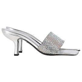 Mule in pelle argentata decorate con cristalli By Far Dylan