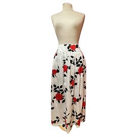 Falda Agnès b. de algodón con flores rojas y negras