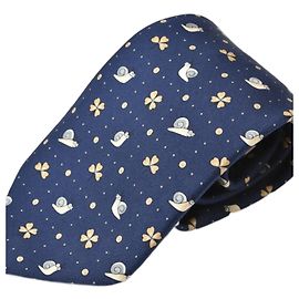 Cravatta Hermès in seta blu con motivo lumaca e trifoglio