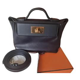 Hermès 24/24 Mini in pelle Swift nera finiture oro