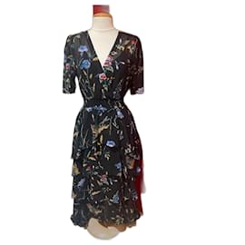 Vestido largo Maje asimétrico con volantes flores multicolores negro