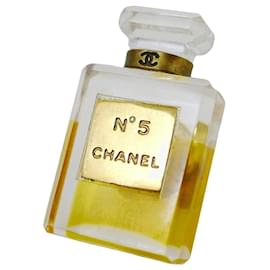 Spilla Chanel Nº5 flacone di profumo dorata