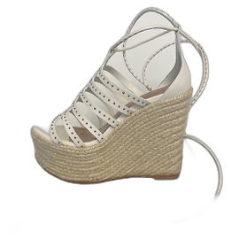 Sandali con zeppa Alaïa in pelle bianca