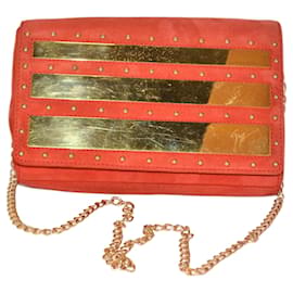 Borsa a mano Giuseppe Zanotti in scamosciato rosso con dettagli dorati