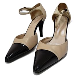 Décolleté bicolore Chanel in pelle beige e nera con cinturino