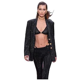 Top reggiseno decorato con cristalli neri Versace Primavera 2020