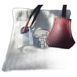 Hermès togo leather bell, pull tab, and lock in red, brand new with dustbag